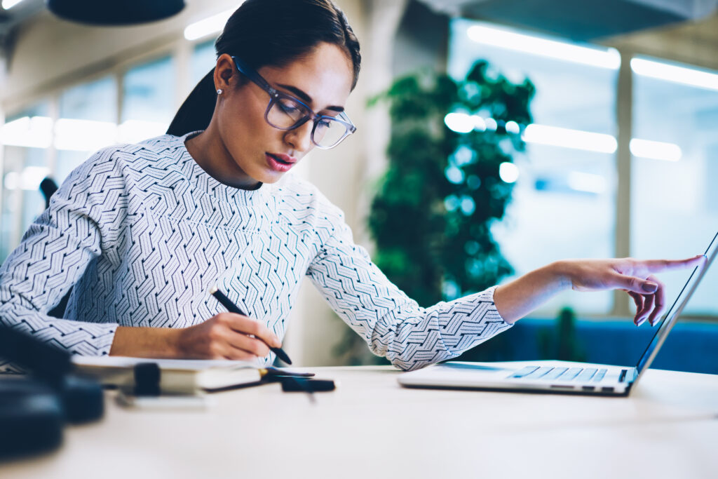 pensive business woman noting idea for startup