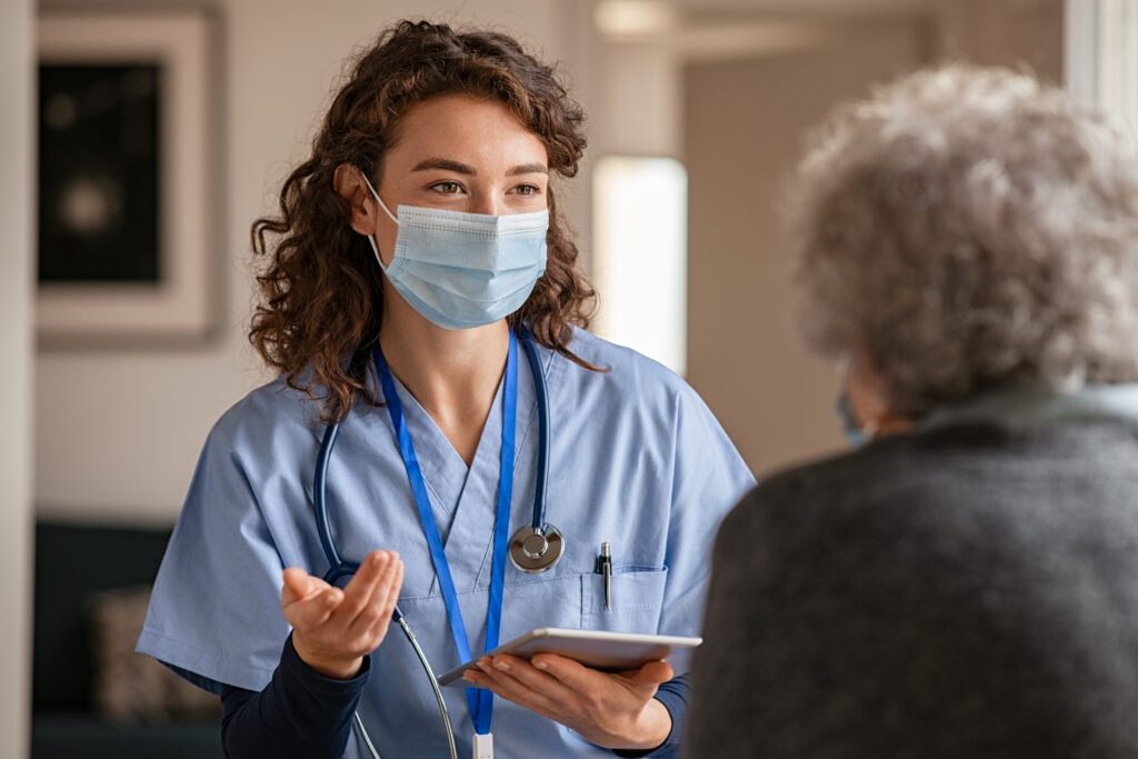 Doctor wearing safety protective mask supporting and cheering
