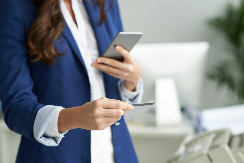 Business lady using credit card to pay