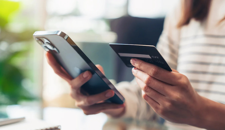 Person holding Phone with card